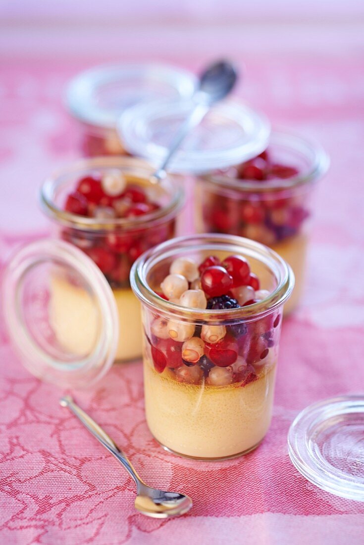 Almond cream with various redcurrants in jars