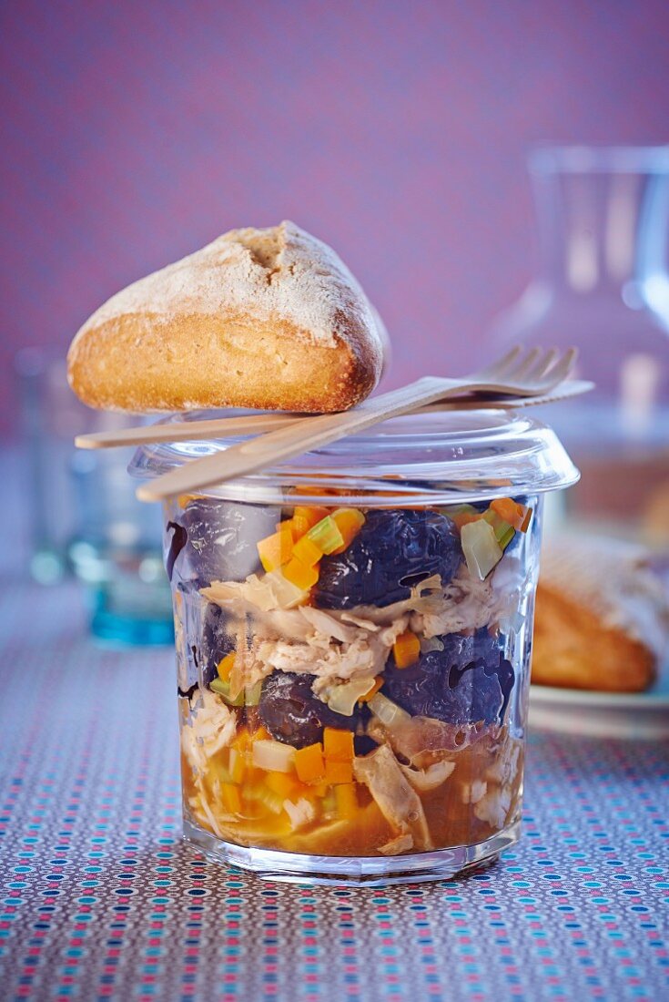 Rabbit with plums and vegetables in a jar
