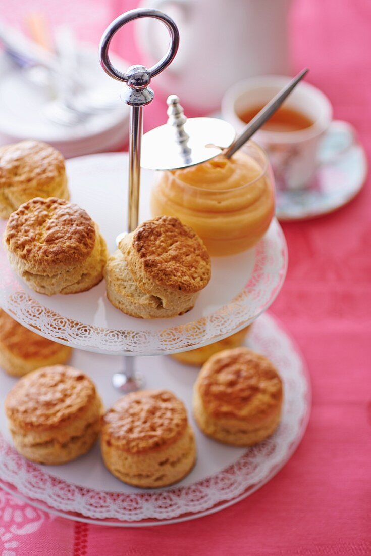 Scones with lemon curd on a cake stand