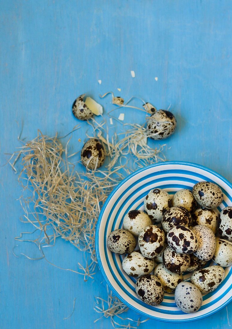 Quails eggs on a plate and next to it