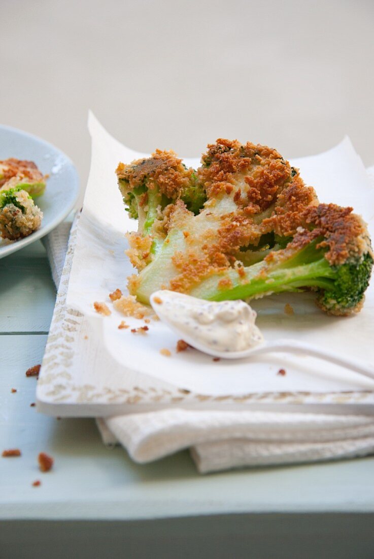 Fried broccoli florets with a Panko coating and a mustard dip