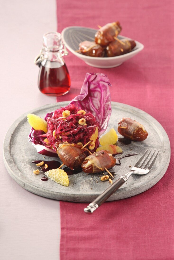 Marinated red cabbage salad with dates wrapped in pancetta and hazelnuts