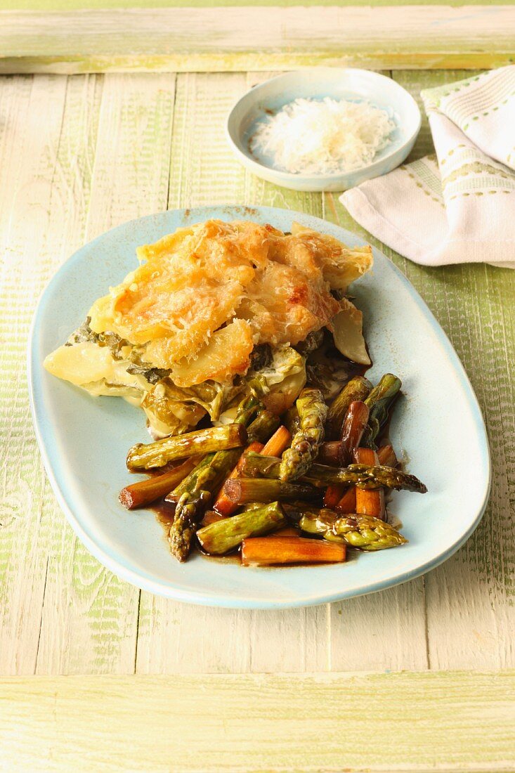 Potato and wild garlic bake with fried green asparagus