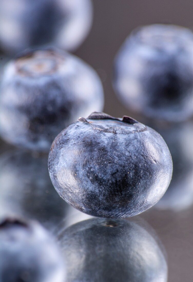 Blueberries on a mirror (close-up)