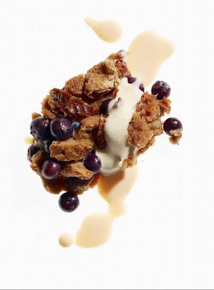 Bread and butter pudding with blueberries and custard