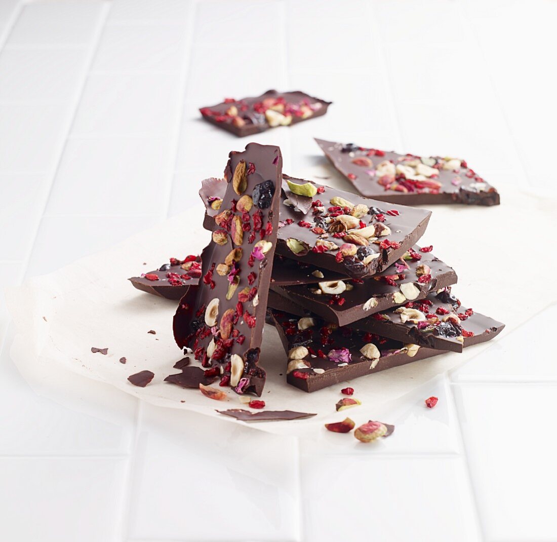 Broken chocolate with nuts and dried berries