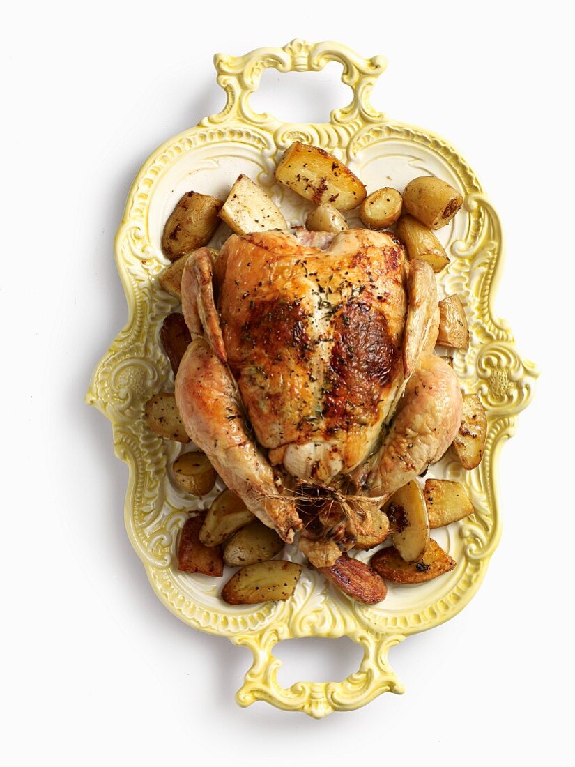 A stuffed turkey on a old-fashioned serving platter