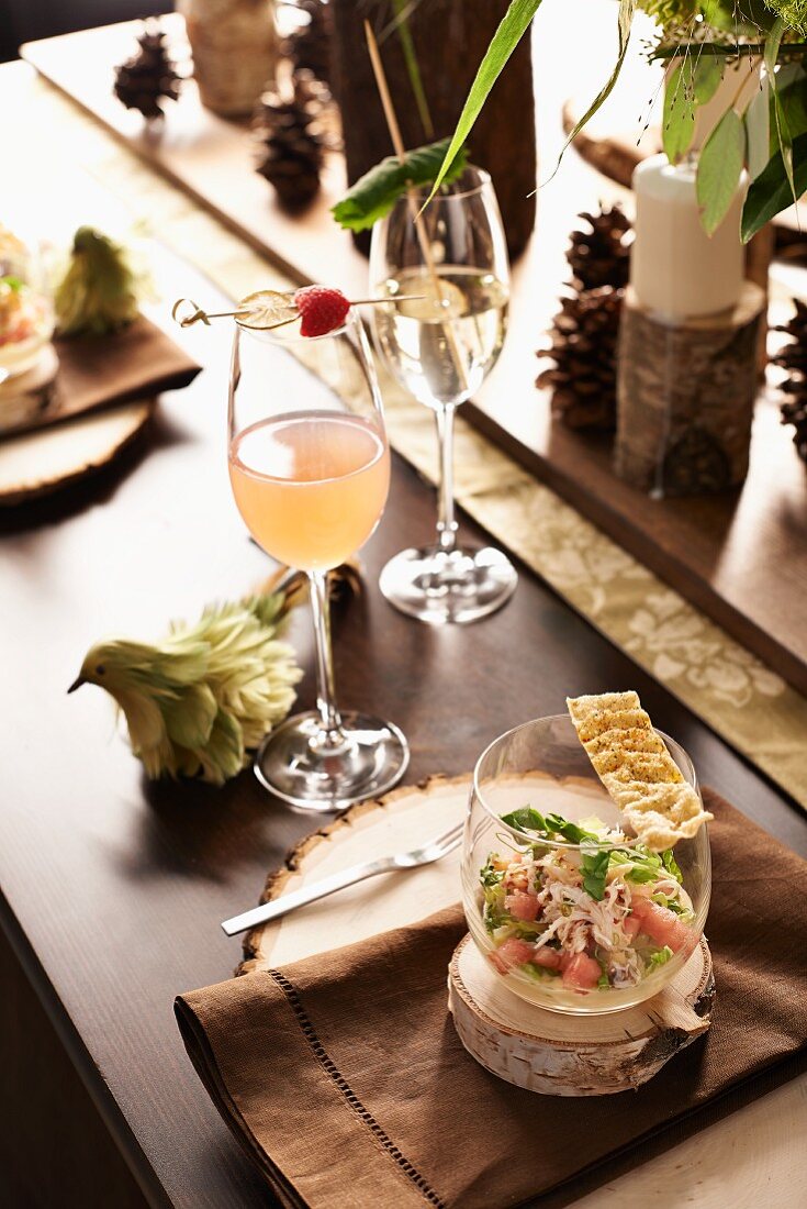 A table laid for Christmas with cocktails and ceviche