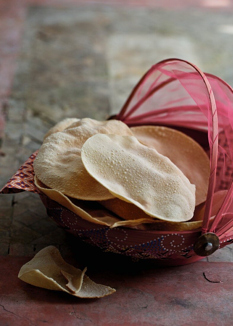 Poppadoms in a bread basket