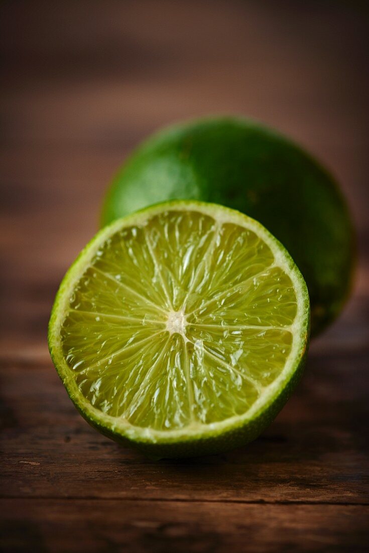 A lime on a wooden surface