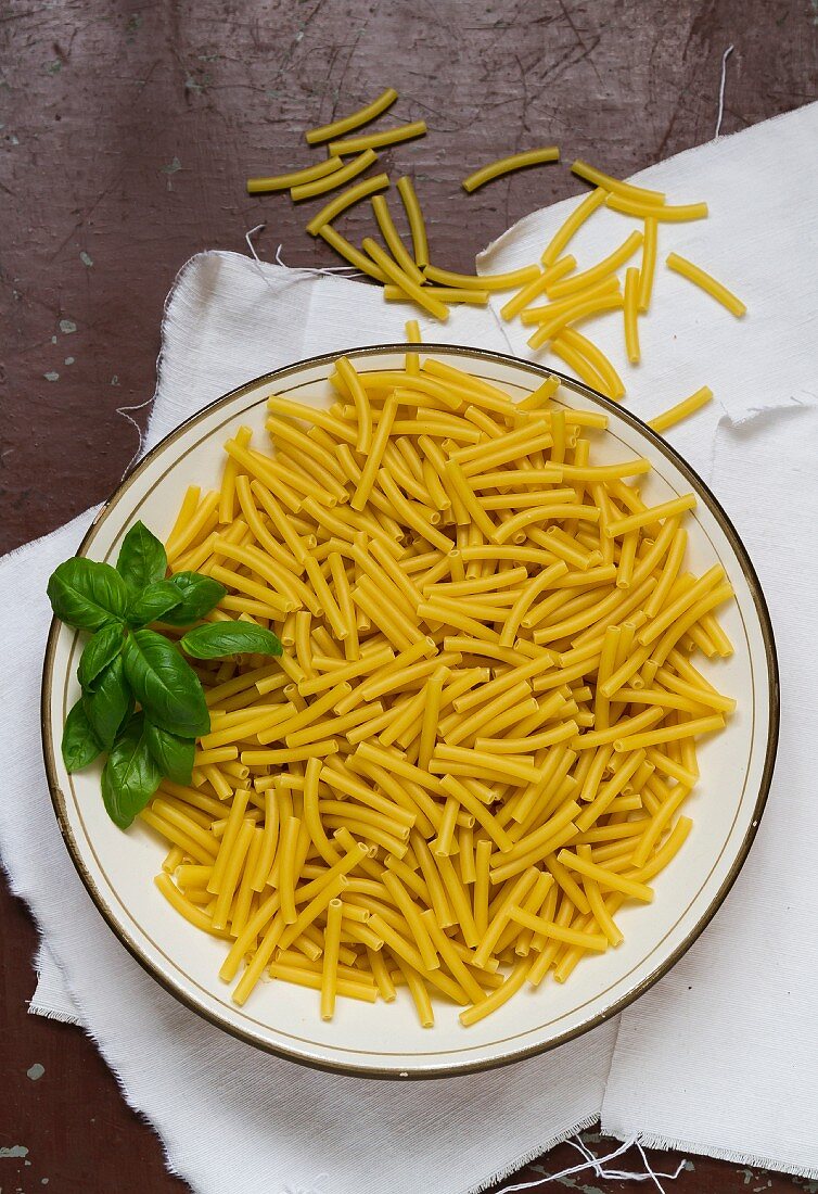 Macaroni and basil on a plate