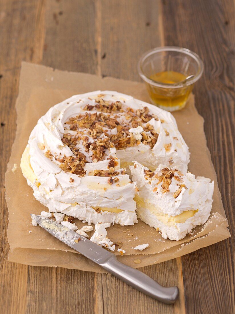 Meringue cake with vanilla cream, sliced