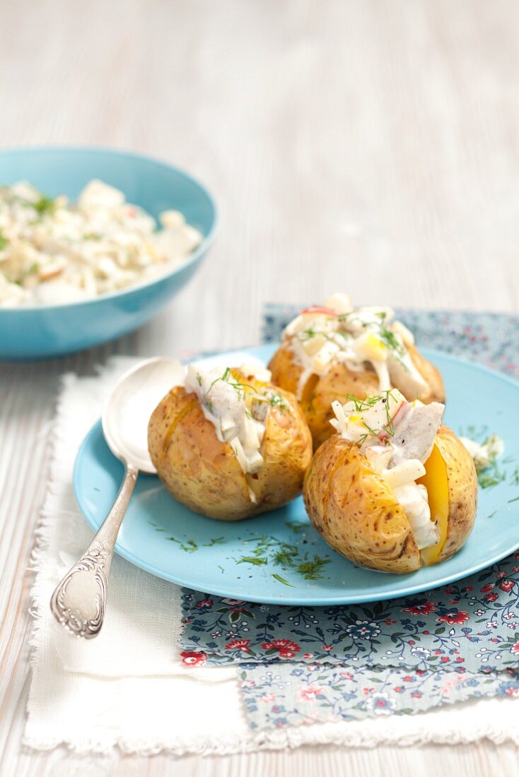 Baked potatoes with herring salad