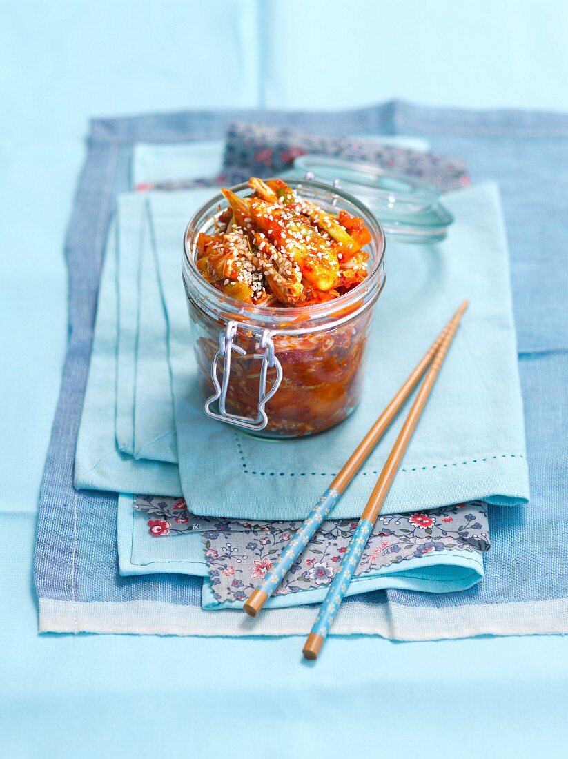 Kimchi with sesame seeds in a preserving jar (Korea)