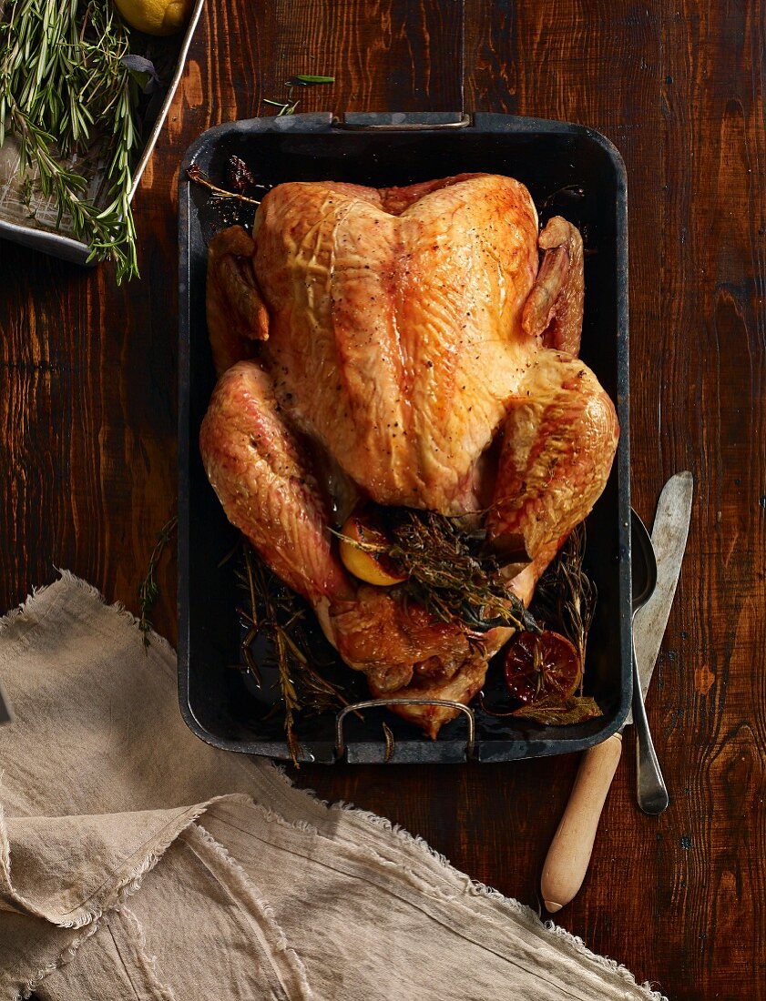 Roast turkey in roasting tin (seen from above)