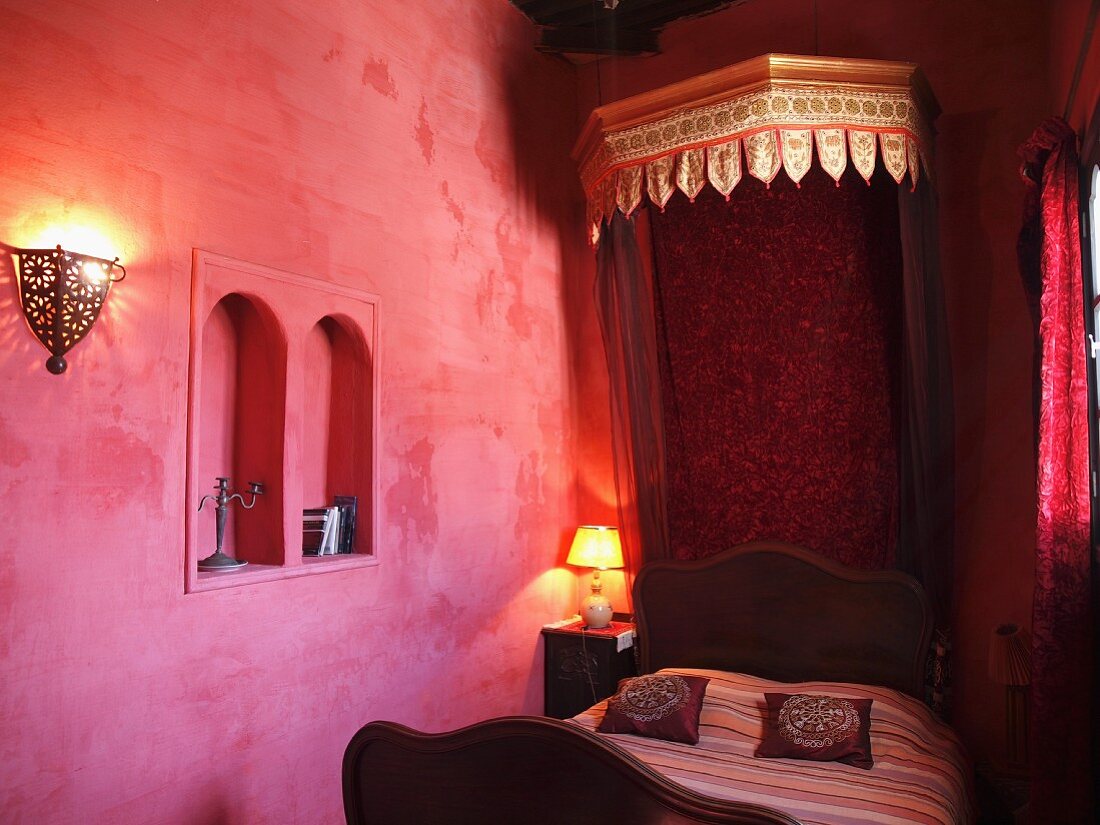 An oriental bedroom decorated in red tone, Larache, Morocco