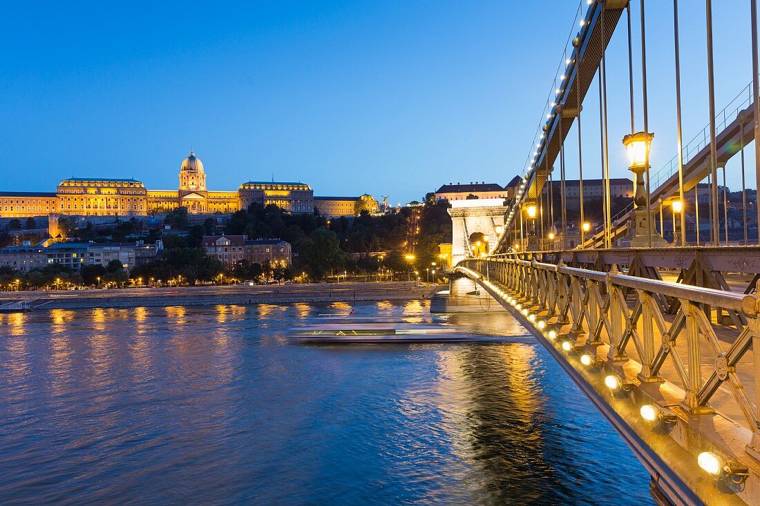 The Chain Bridge by dusk with a view of Buda Castle, Budapest, Hungary