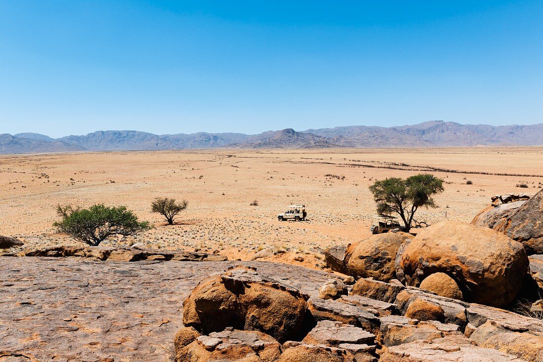 Jeeps in the NamibRand Nature Reserve at the foot of the Nubib Mountains, Namibia, Africa