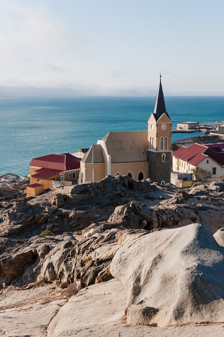 The monolithic church rising above the bay of Lüderitz, Namibia, Africa