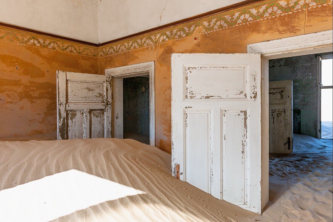 The sand has drifted metres high in the abandoned houses in Kolmannskuppe, Namibia, Africa – formerly one of the richest towns in Africa