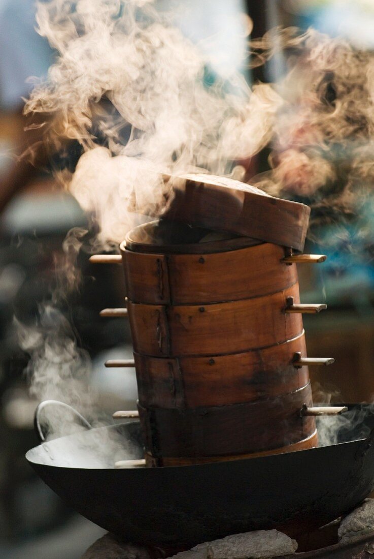 Steaming baskets in a wok, Leshan, Sichuan, China, Asia