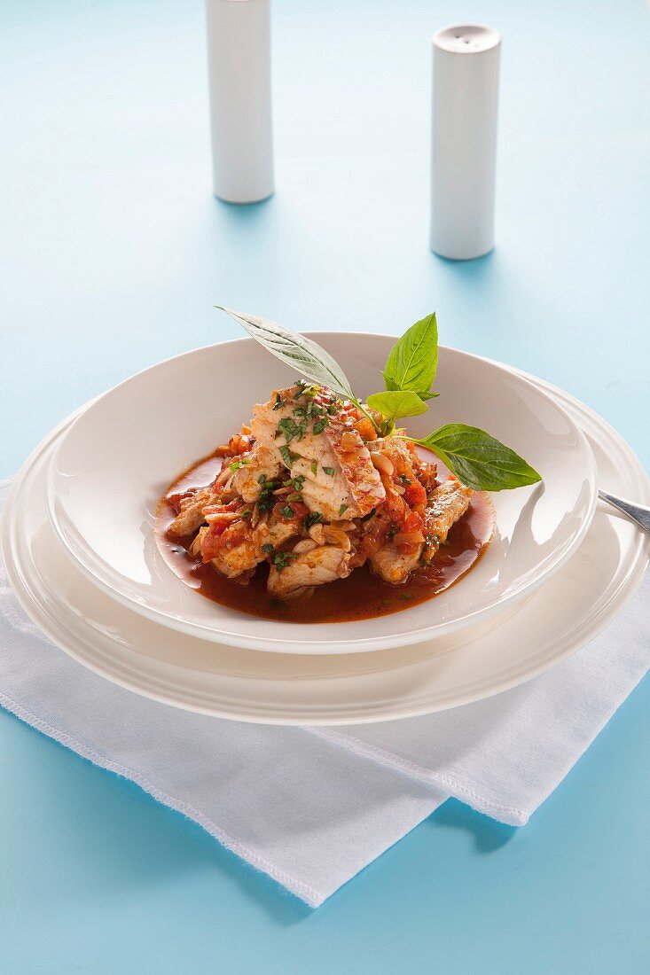 Baked red snapper in tomato sauce