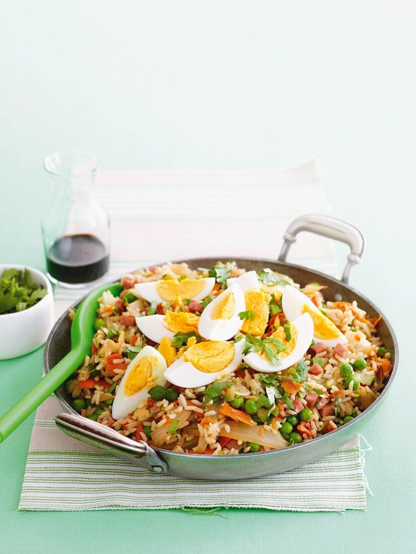 Fried rice with bacon, vegetables and eggs