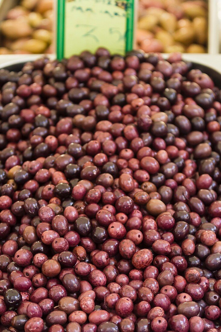 A pile of olives at a market