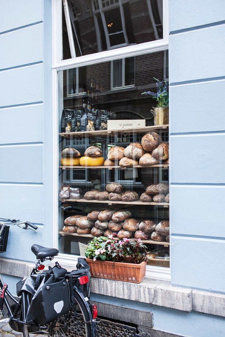 Various types of bread in the window of a bakery