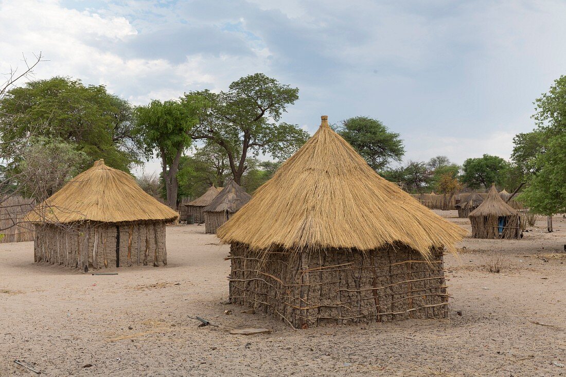Traditionally built straw huts and farmsteads in the village of Morero near the Kwando River