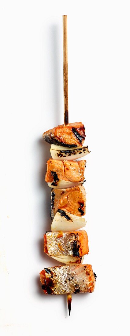 A grilled wild salmon skewer with onions