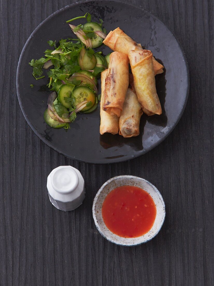 Spring rolls with cucumber salad and sweet and sour chilli sauce