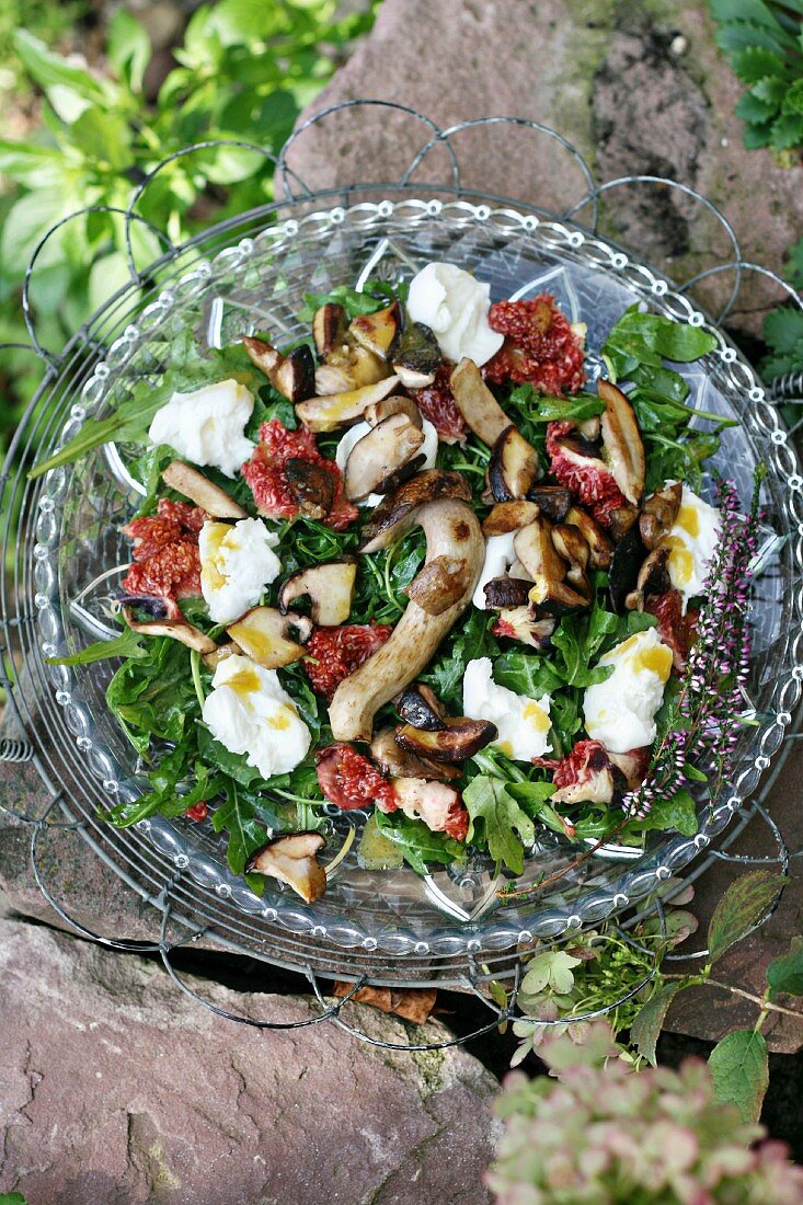 An autumnal salad with rocket, fresh figs, fried porcini mushrooms and buffalo mozzarella