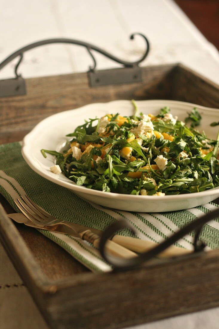 Rocket salad with mango and feta cheese