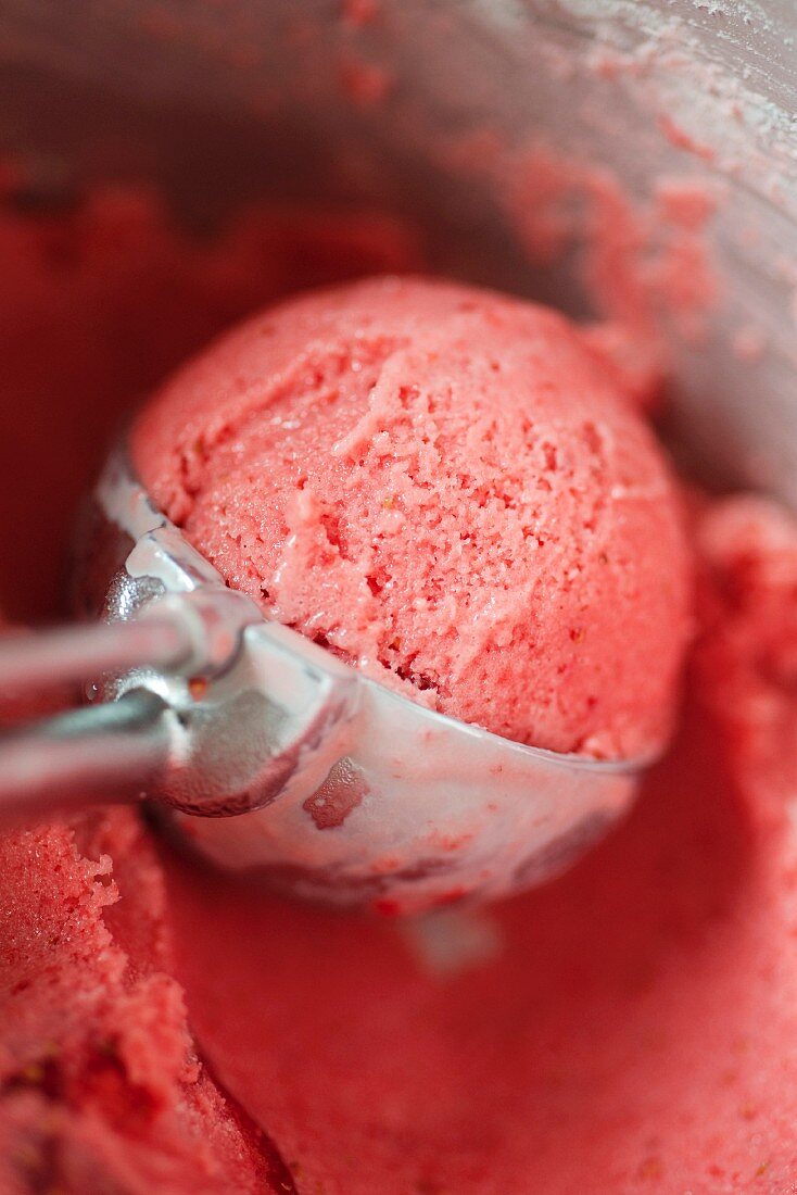 Strawberry ice cream in a scoop