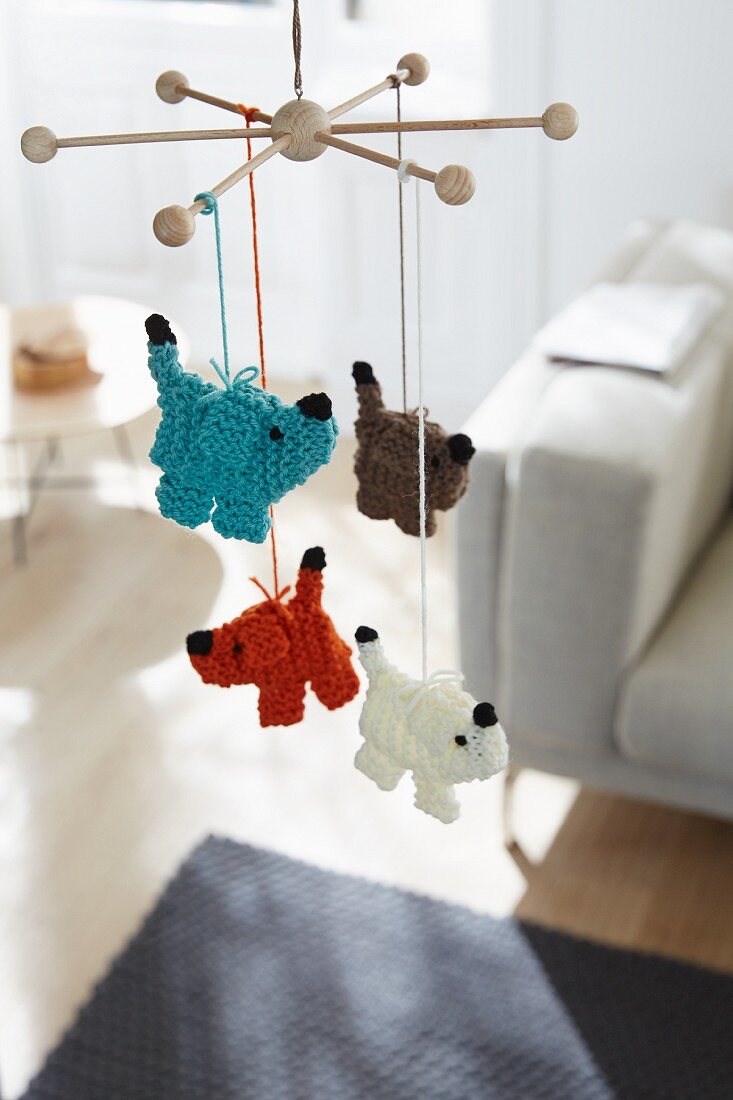 Knitted dogs hanging on a mobile