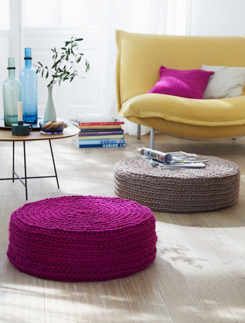 Crocheted floor cushions in purple and beige