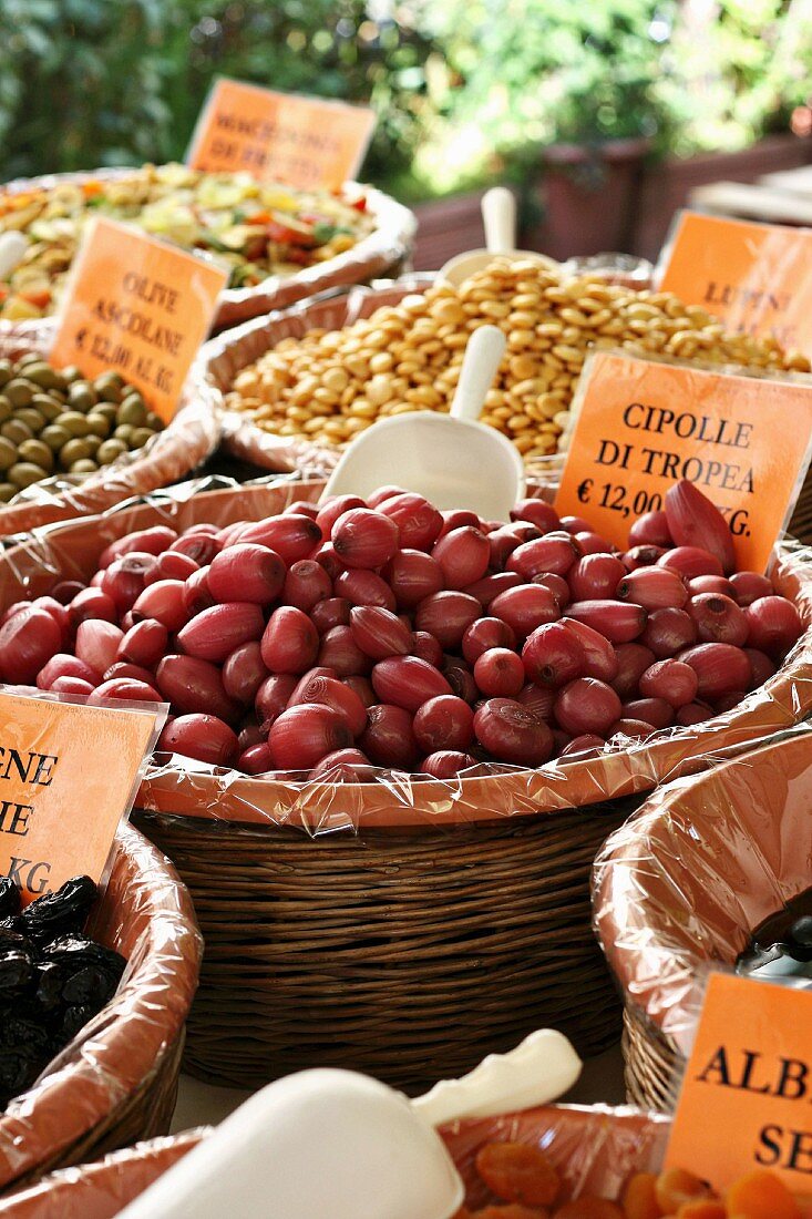 Tropea onions, olives and lupins on a vegetable stand