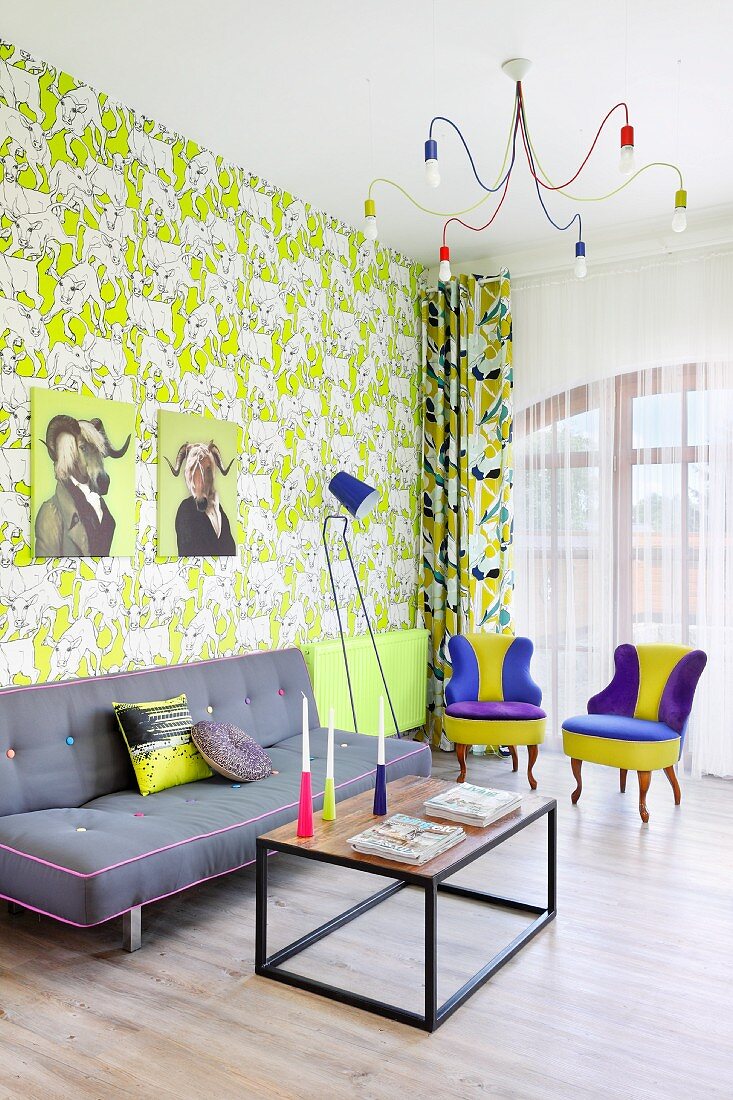 Colourful living area with patterned wallpaper in retro interior