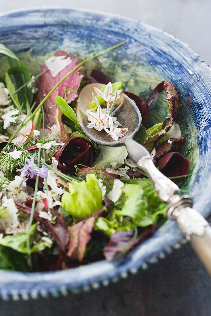 A mixed leaf salad with edible flowers