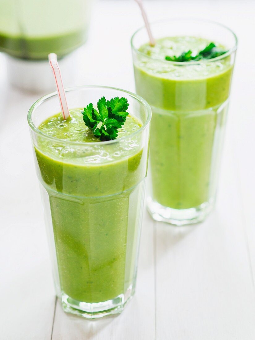 Green smoothies garnished with parsley