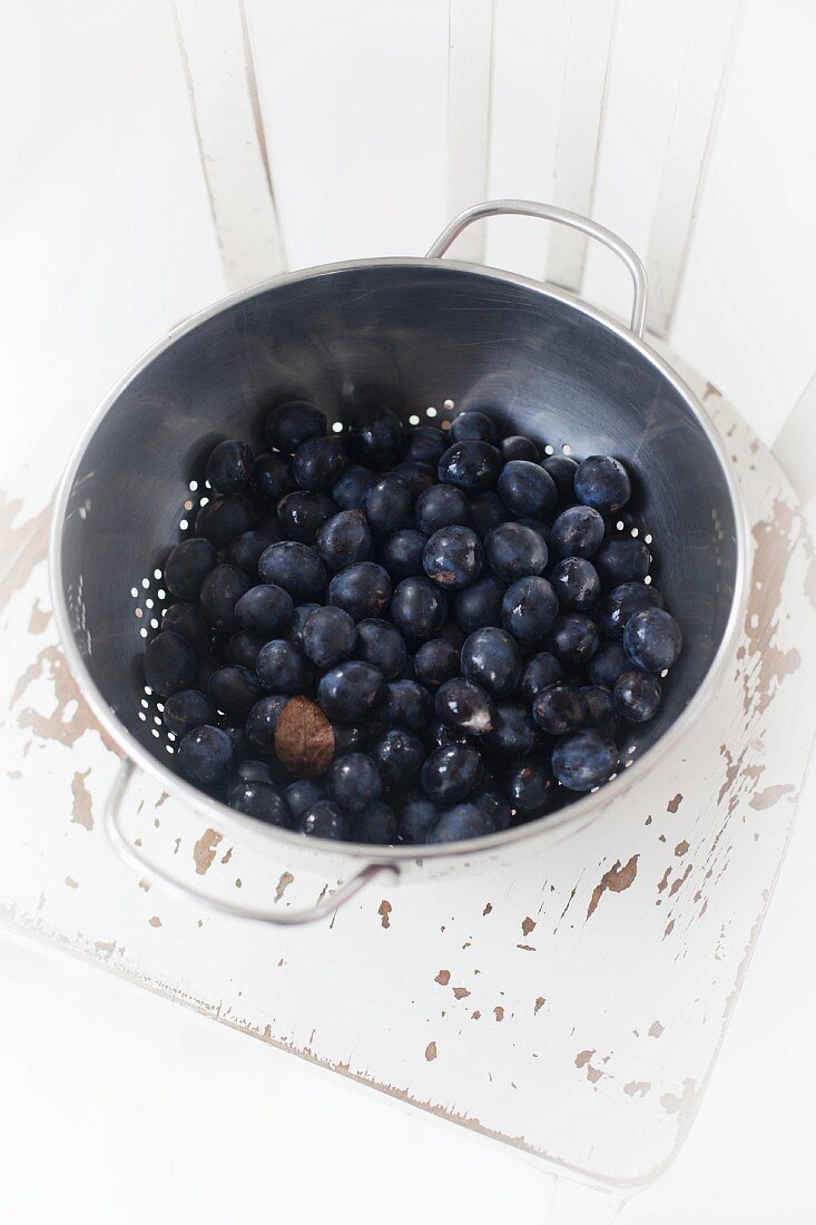 Fresh blueberries in a colander