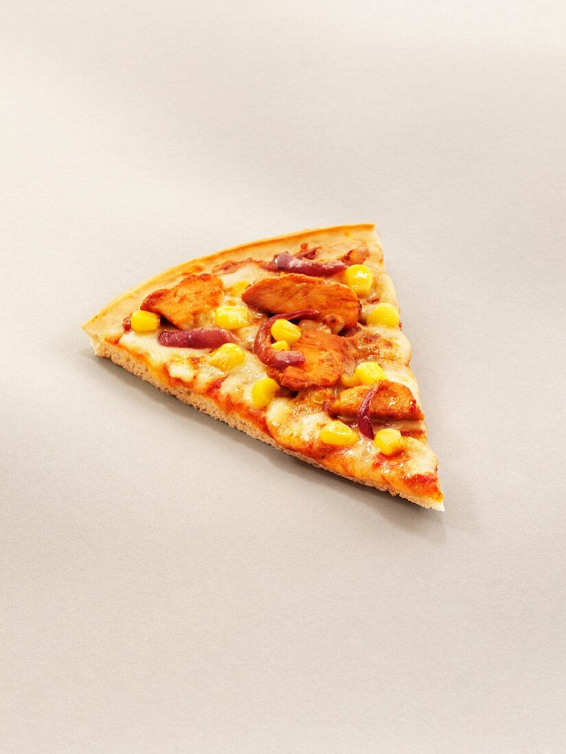 A slice of pizza with grilled chicken, sweetcorn and red onion