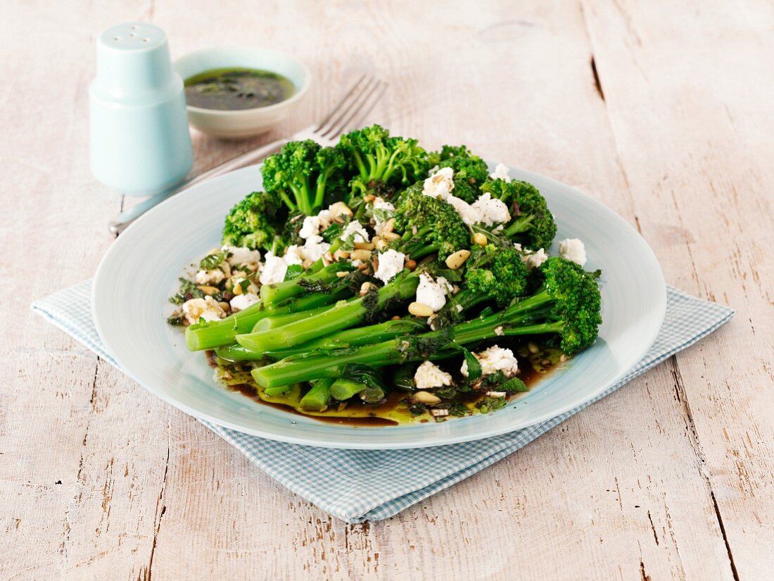 Broccoli salad with feta cheese, pine nuts and vinaigrette