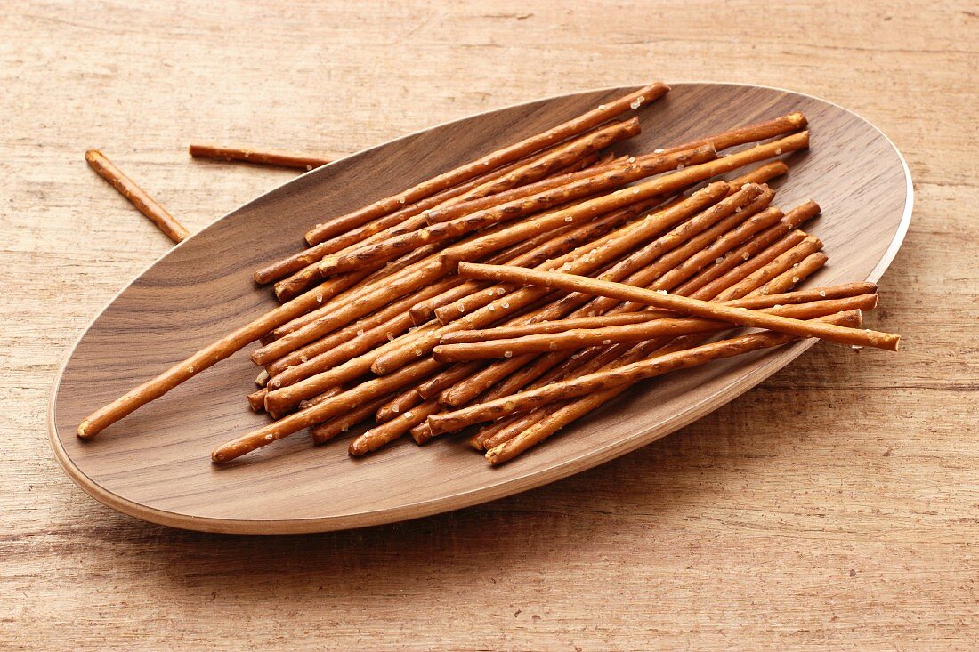 Pretzel sticks in a wooden dish