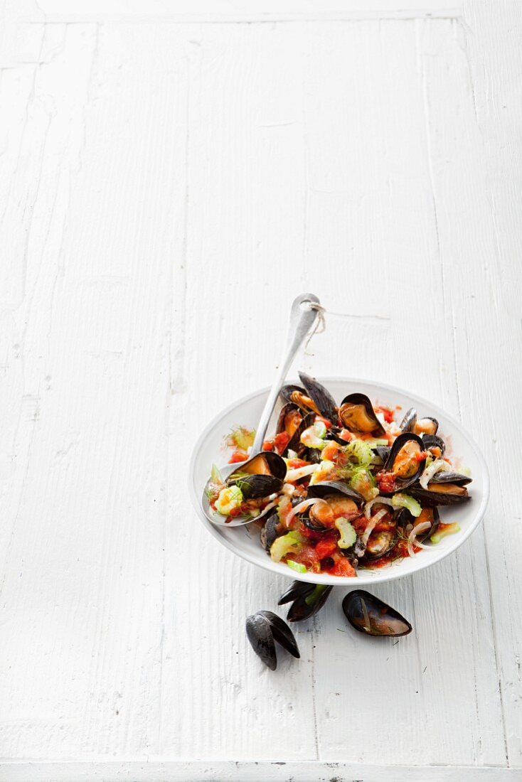 Mussels in a wine broth with celery and tomatoes