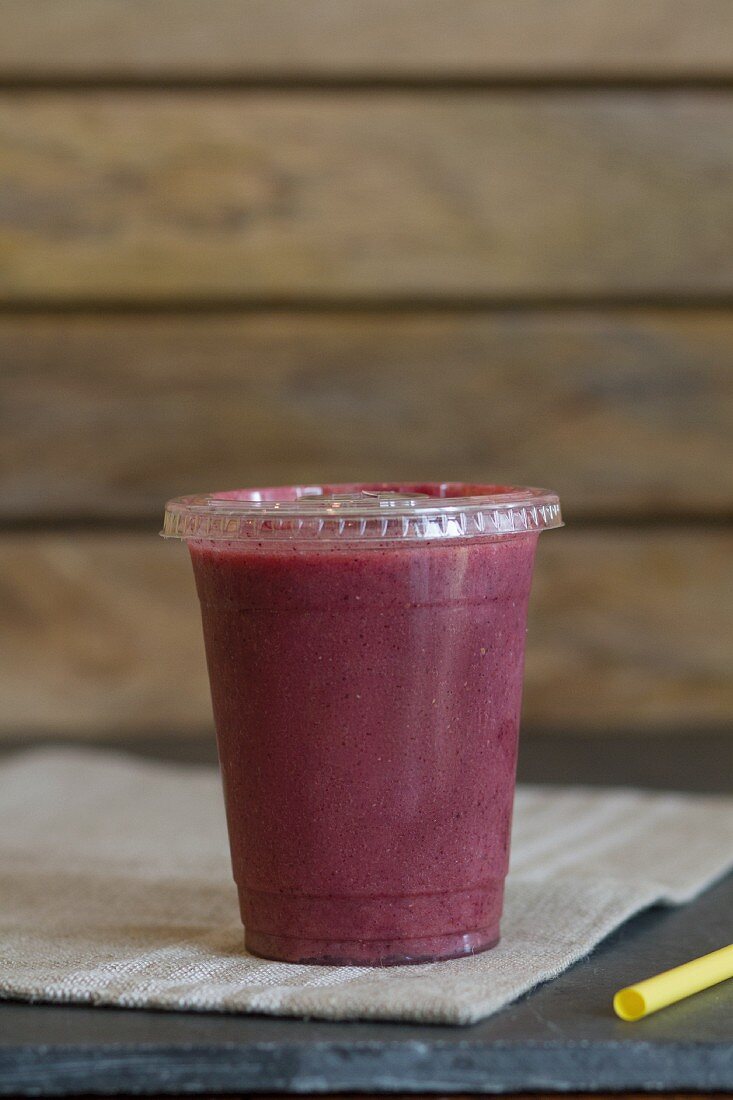 A smoothie made with coconut water, lemons, strawberries, blueberries, bananas and goji berries