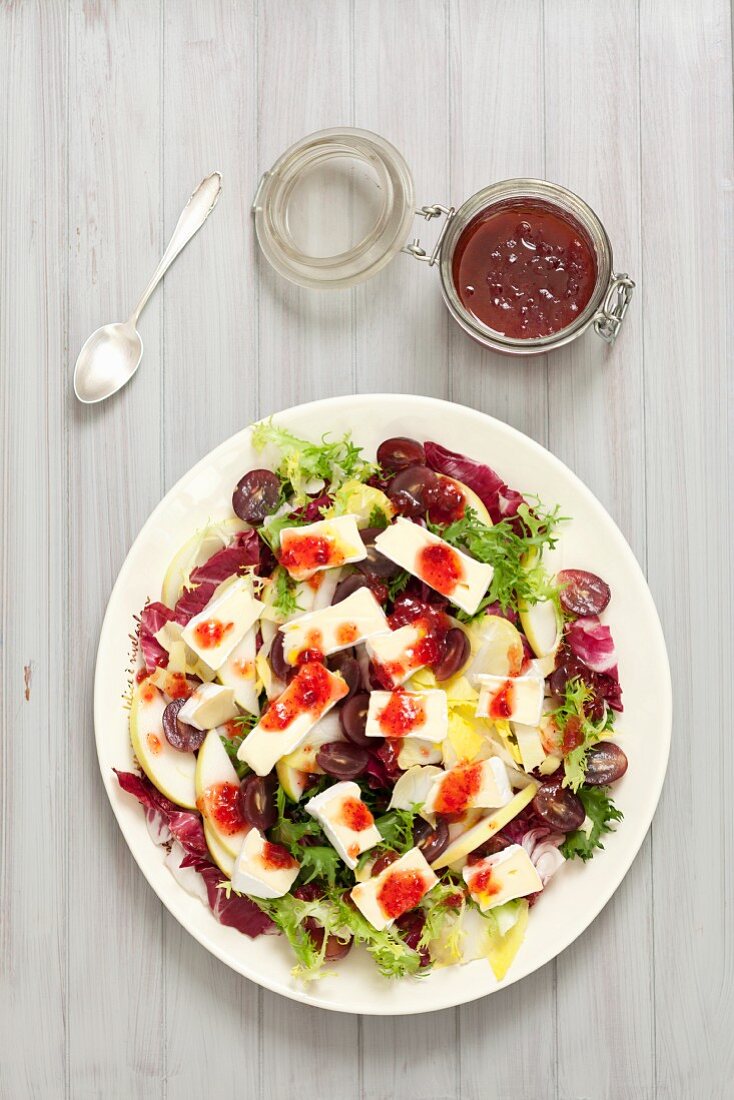 Radicchio and chicory salad with Camembert, apples, grapes and cranberry vinaigrette