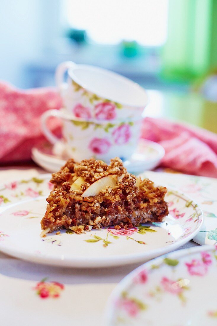 Apple tart with a pecan nut, apricot and raisin base