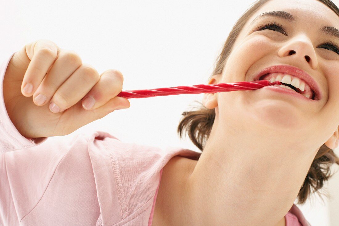 A girl eating liquorice